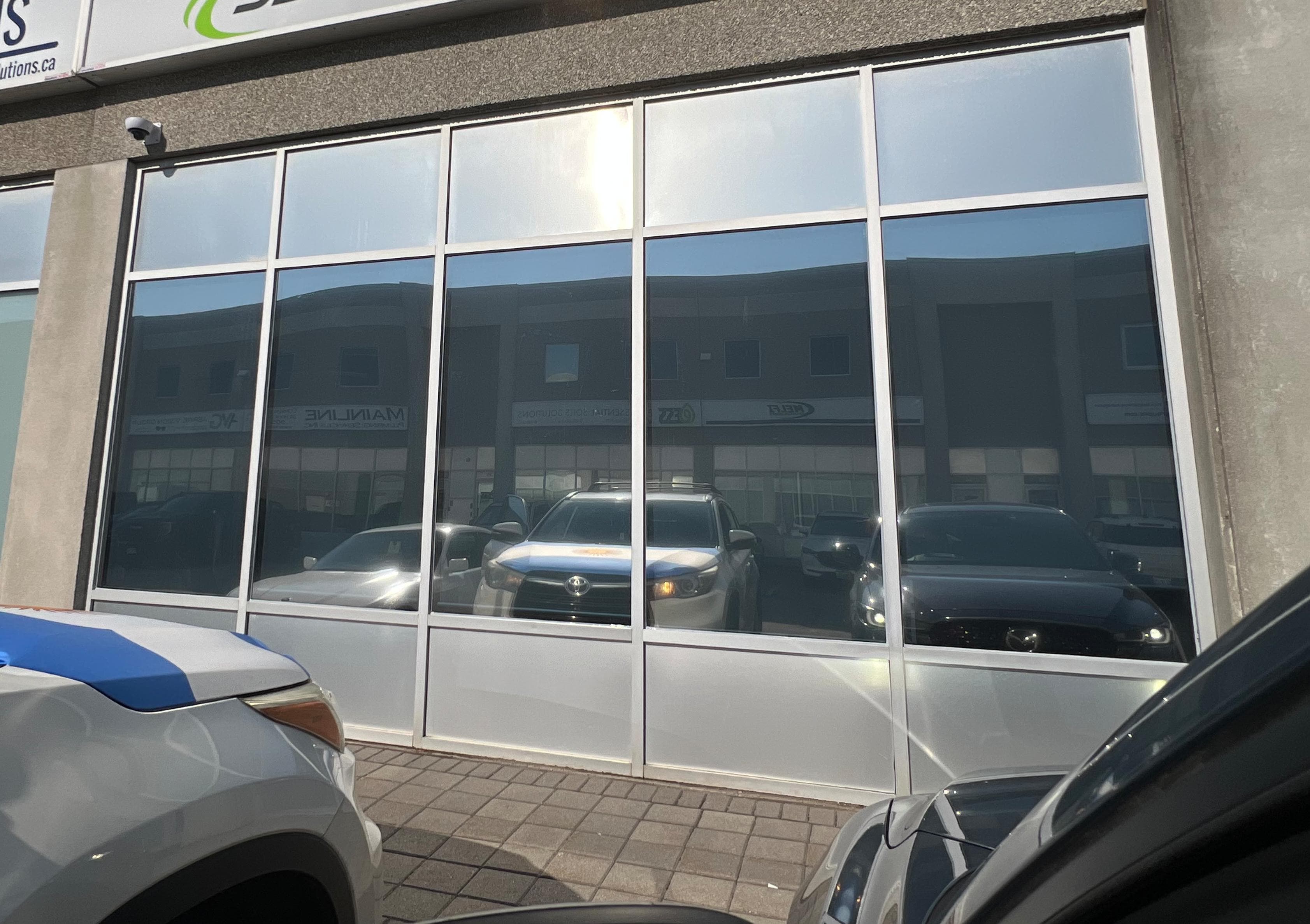 Commercial storefront with professionally installed privacy window film