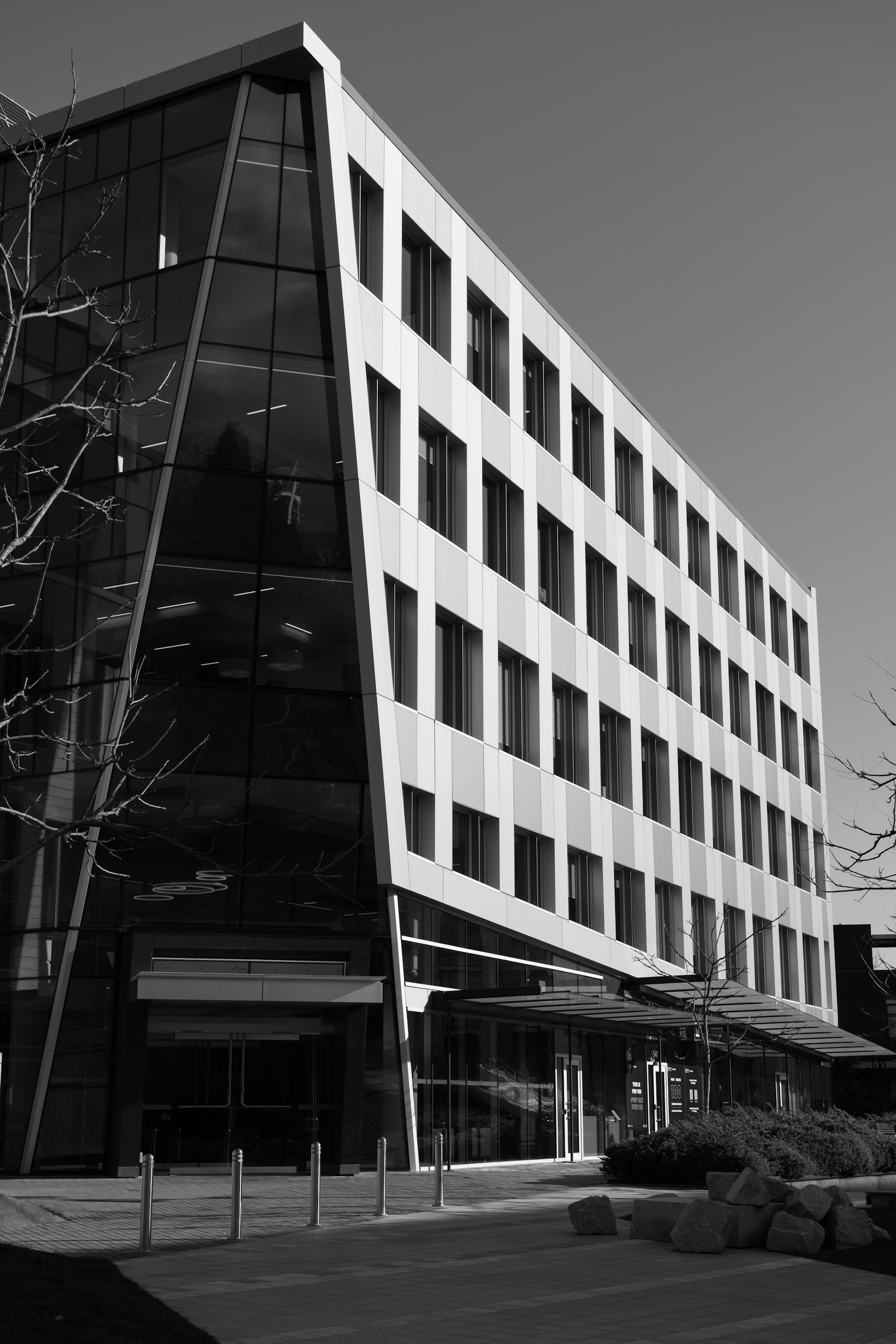 Exterior of a modern commercial building with expansive glass windows